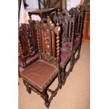 A set of twelve 19th century oak standard dining chairs with foliate carved backs and brown