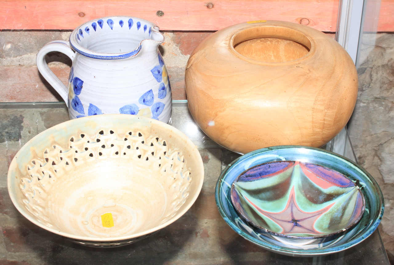 An Aldermaston pottery bowl, 6 1/2" dia, two other similar bowls, a tin glazed jug, and a turned