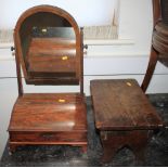 A mahogany swing frame toilet mirror with storage compartment, on bracket supports, 12" wide, and an