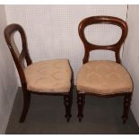 A set of six Victorian mahogany loop back dining chairs, upholstered in a pink brocade, on turned