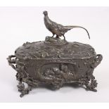 A 19th century French bronze casket with pheasant surmount and gamebirds decoration, on twig