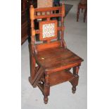 A late 19th century oak metamorphic library chair/step, on shaped supports, 36" high overall