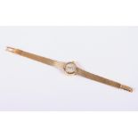 A 14ct gold Omega "Ladymatic" bracelet watch with silvered dial and baton numerals, 25.6g gross