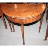 A Georgian mahogany circular fold-over top card table, on turned supports with pad feet, 30" dia