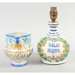 A tin glazed earthenware bottle, "Salix Nigra", 6 3/4" high, converted to a table lamp, and a