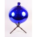 A 19th century blue and mirror glass sphere/witch ball, 14" dia, on a 19th century turned wood