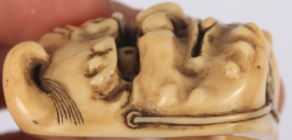 A Japanese Meiji period carved ivory mask Netsuke, Oni to the front, Okame to the back, 2" high - Image 6 of 8