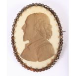 A 19th century engraved bone oval plaque of Shakespeare, commemorating his 250th Anniversary, with