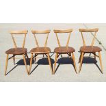 A set of four 1960s Ercol 392 stick back stacking chairs with elm panel seats, on splay supports
