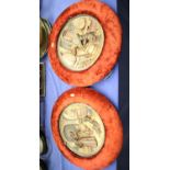 A pair of continental ceramic plaques, decorated figures in a cellar, in red velvet frames, 12" dia