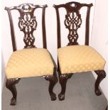 A late 19th century tub-shape armchair, upholstered in an old gold Draylon, on turned and castored