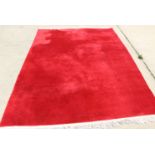 A Chinese crimson hand-knotted contour wool pile carpet, 144" x 110" approx