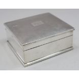 A silver cigarette box with engine turned lid and a pair of engine turned silver backed clothes