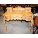 A polished as walnut Louis XVI design dressing table, fitted two jewel drawers over three further