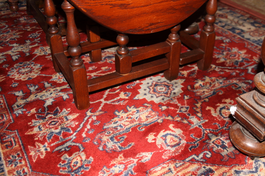 A Middle Eastern wool rug with central medallion, gulls and multi-guard borders on a red ground with - Image 2 of 3