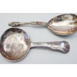 A Georgian silver caddy spoon and one other adapted from an Apostle spoon, 1oz troy approx