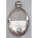 A Victorian silver spirit flask with removable cup and a glass spirit flask with silver cap
