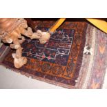 A Persian tribal prayer rug with blue ground, and multi borders in shades of rust red and natural,