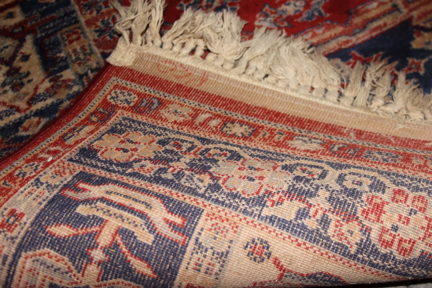 A Middle Eastern wool rug with central medallion, gulls and multi-guard borders on a red ground with - Image 3 of 3