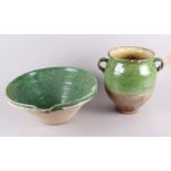 An 18th century green glazed lipped bowl, 15 1/2" dia, and a similar two-handled vase, 11" high