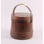 A 19th century "Shaker" coopered softwood pail and cover with swing handle, 14" high