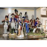 Eleven Continental porcelain military figures, largest 12" high