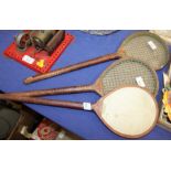 A pair of 19th century battledore and shuttlecock rackets and another racket