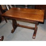 An oak low coffee table, on panel end supports, 30" wide x 15 1/2" deep x 19 1/2" high