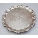 A Georgian silver piecrust salver, on three hoof feet, 16.2oz troy approx