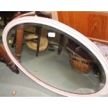 A pink painted framed wall mirror, 29" x 19", and one other wall mirror, 26" x 21"