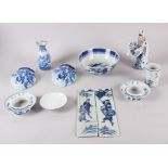 A pair of Chinese blue and white wall pockets, decorated landscapes, two dish stands, two finger
