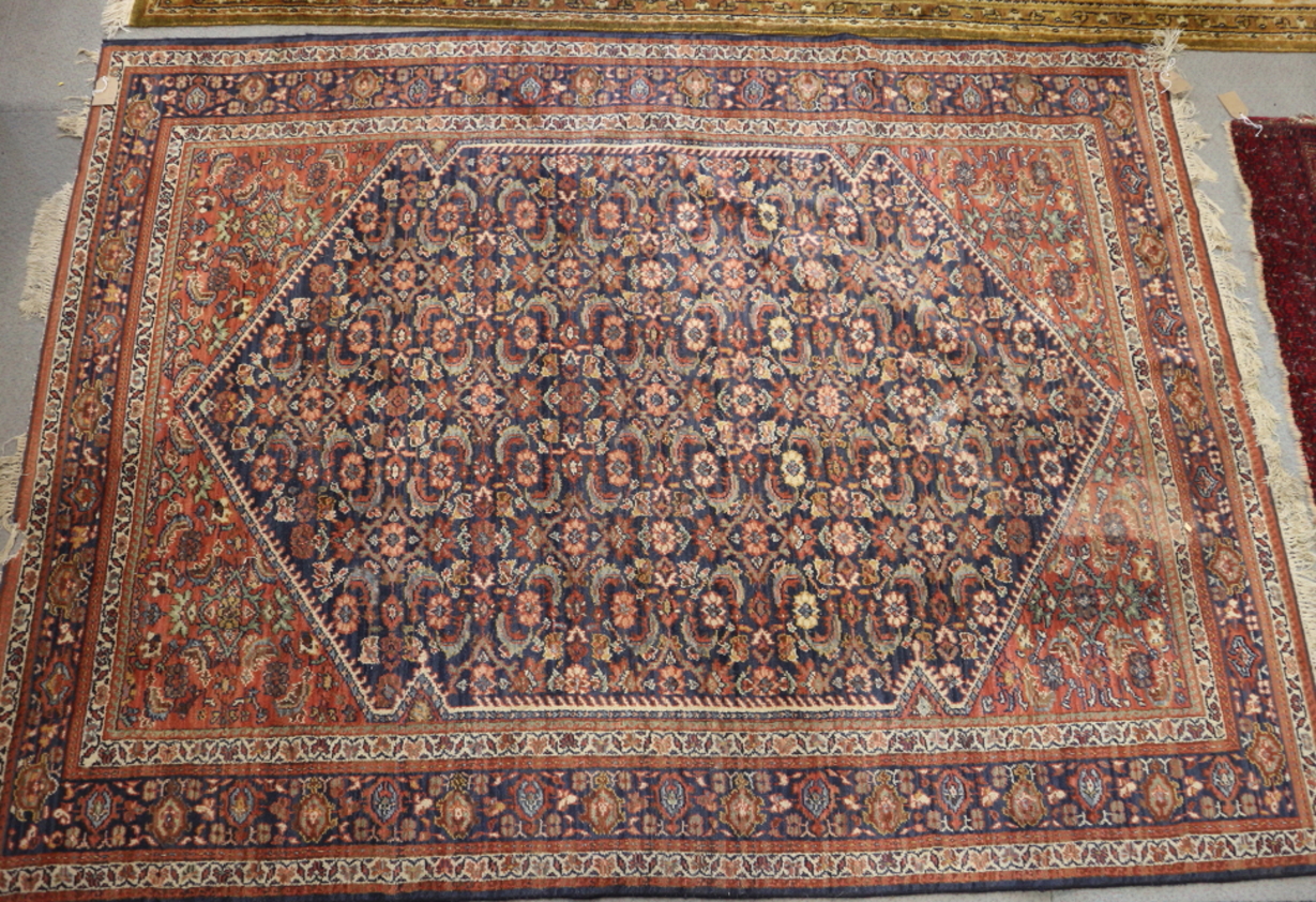 A Herati design rug with all-over design on a dark blue ground with multi-borders, 90 1/2" x 66 1/2"