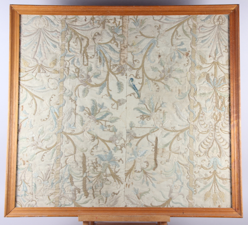 A panel of 18th century? silk embroidered scroll and flower work, 26" x 29", in strip frame, and a