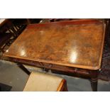 A Gillows design mid-19th century figured walnut ledge back side table, fitted two drawers, on