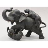 A 19th century Japanese bronze of an elephant and tigers, 5 1/2" high