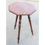 An Edwardian walnut octagonal top occasional table, on three turned and tapering splay supports,