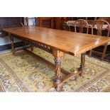 A Brights of Nettlebed Gothic design oak refectory table with pierced frieze, on spiral turned and