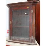 A mahogany corner display cabinet enclosed glazed panel door, 28" wide x 34" high x 14" deep