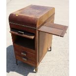 A 1930s walnut office cabinet, fitted lift-up front compartment, two drawers with slide to side