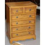 A yew and banded bowfront chest of two short and four long drawers, 24 1/2" wide x 33" high x 16"