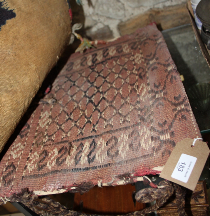 A Middle Eastern saddle bag with geometric design on a red ground and multi-borders in shades of - Bild 2 aus 2