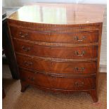 A bachelor's mahogany and box line inlaid bowfront chest of four long graduated drawers with