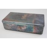 An Asprey silver plated sandwich box with engraved crest and monogram