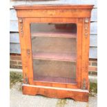 A 19th century walnut and gilt brass mounted and inlaid pier cabinet enclosed glazed panel door,