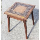 A carved oak square top occasional table, on turned splay supports, 15" square x 18" high