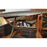 A teak octagonal garden table and a number of folding chairs