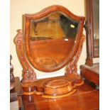A Victorian walnut shield-shaped toilet mirror, on serpentine base fitted jewel compartment, 21"