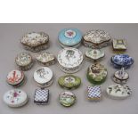A quantity of enamel decorated pill boxes, including Limoges and ceramic boxes