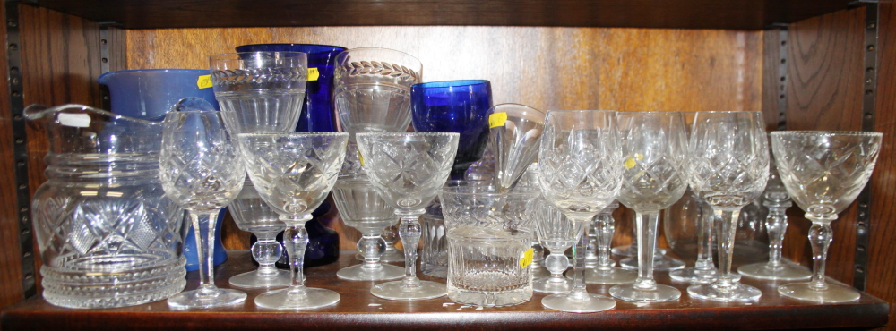 Six Stuart crystal goblets, six similar port glasses, a blue glass vase and other drinking vessels