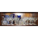 Six Stuart crystal goblets, six similar port glasses, a blue glass vase and other drinking vessels